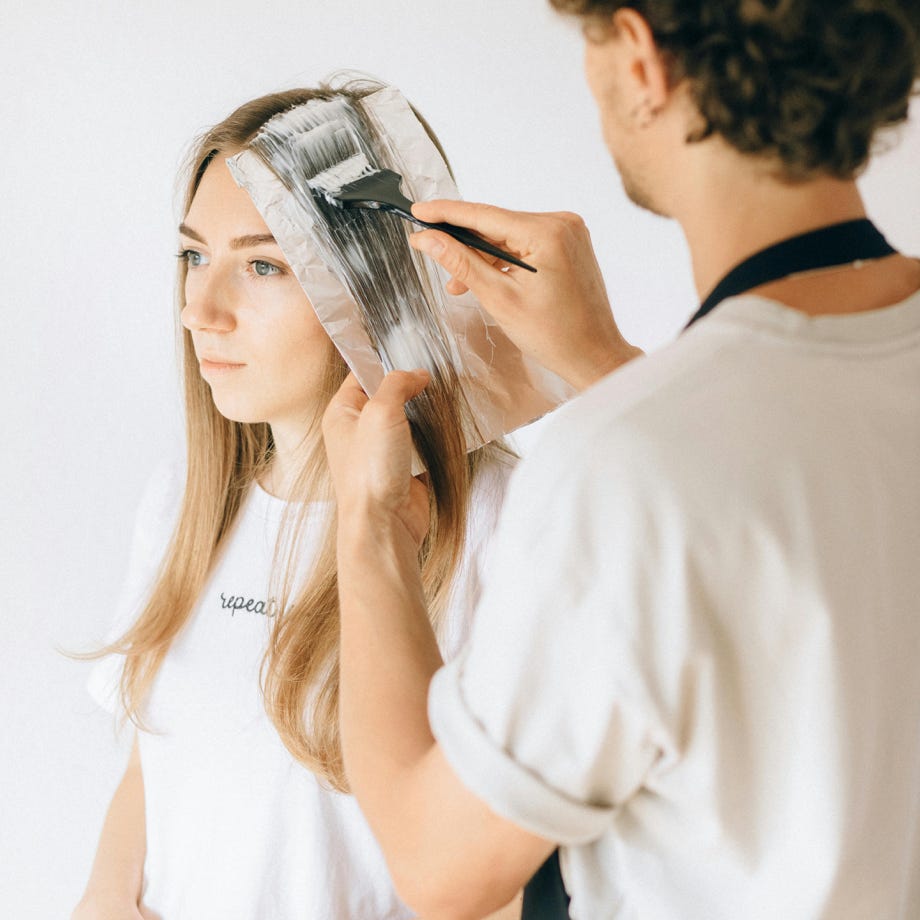 A Woman Having Her Hair Dyed